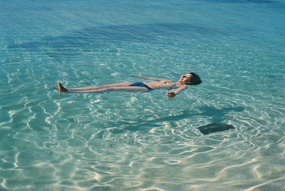 cuba-trinidad-caribbean-sea-playa-ancon-woman-floating-on-clear-water-shadow-1-my