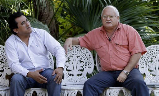 Salvadorans Ernesto Cruz Leon, left, and Otto Rene Rodriguez wait to be interviewed by The Associated Press in Havana, Cuba, Tuesday Feb. 8, 2011. Both are serving time in a Cuban prison for their involvement in a 1990's bombing campaign against Cuba’s tourism industry. - AP Photo  Read more:<a rel=