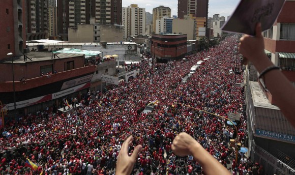 The coffin of Venezuela's late President Hugo Chavez is driven through the streets of Caracas after leaving the military hospital where he died of cancer in Caracas