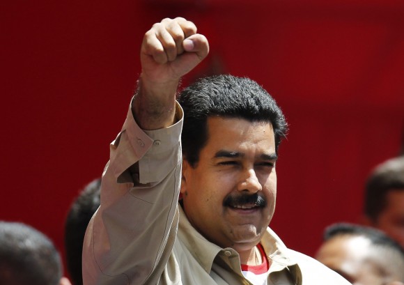 Venezuela's VP Maduro greets supporters during a rally in Caracas