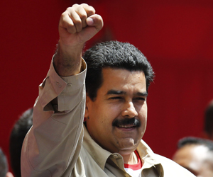 Venezuela's VP Maduro greets supporters during a rally in Caracas