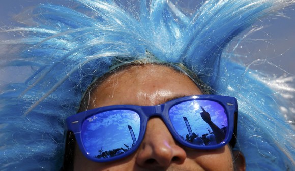 An Argentina soccer fan cheers outside the World Cup 2014 soccer stadium prior to the Group F match between Argentina and Iran in Belo Horizonte