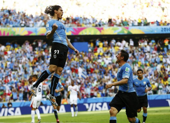 Uruguay's Cavani celebrates his goal against Costa Rica with Rodriguez during their 2014 World Cup Group D soccer match at the Castelao stadium in Fortaleza