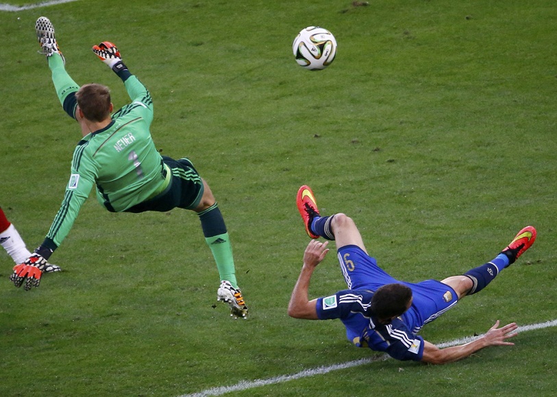 Argentina's Gonzalo Higuain collides with Germany's goalkeeper Manuel Neuer during their 2014 World Cup final at the Maracana stadium in Rio de Janeiro