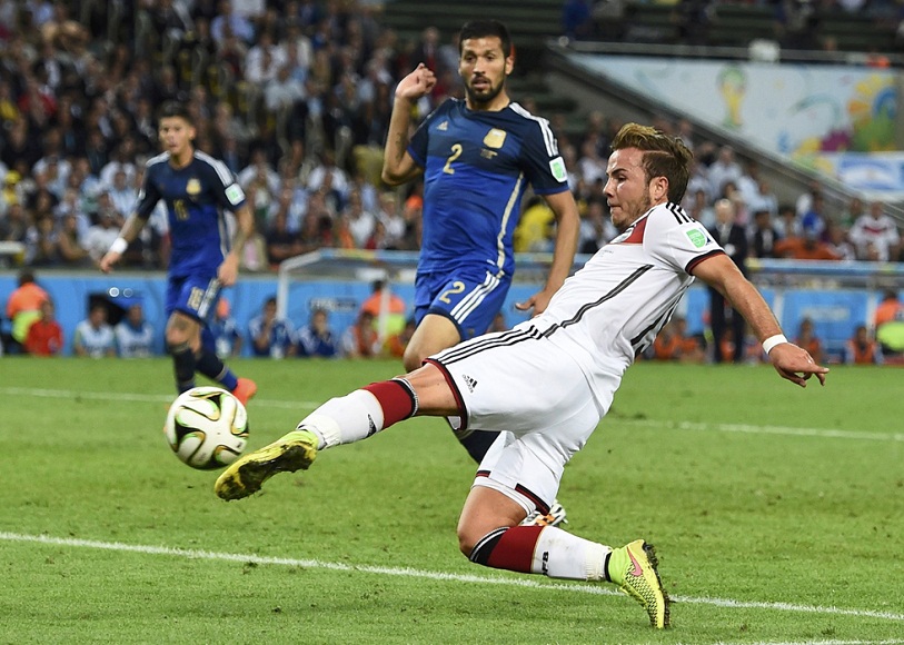 Germany's Goetze shoots to score a goal against Argentina during extra time in their 2014 World Cup final at the Maracana stadium in Rio de Janeiro