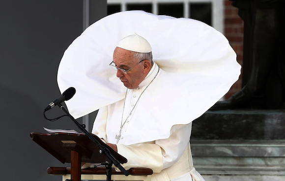 The wind lifts Pope Francis' mantle as he delivers his speech in front of Independence Hall, Saturday, Sept. 26, 2015, in Philadelphia.  (Tony Gentile/Pool Photo via AP)