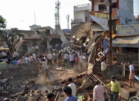 People stand near the site of an explosion in Jhabua district at Madhya Pradesh