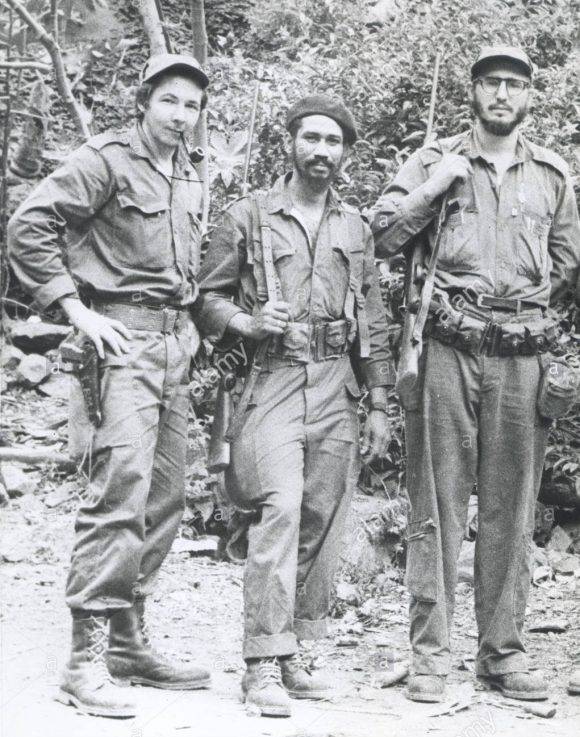 FIDEL CASTRO (far right), with his brother RAUL CASTRO (far left), and JUAN ALMEIDA (center), know as 'Cuban Rebels', c. 1959