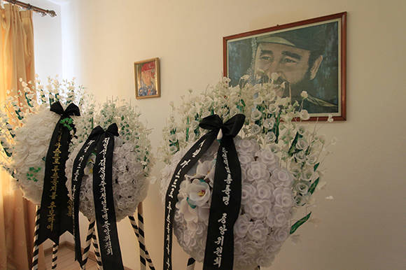 Wreaths are laid in front of a portrait of the late Fidel Castro at the mourning room of the Cuban embassy in Pyongyang, North Korea, Tuesday, Nov. 29, 2016. North Korea is observing a three-day period of mourning for Castro, who was seen by the North as a comrade-in-arms against the common enemy of the United States. Castro died Friday at age 90. (AP Photo/Jon Chol Jin)