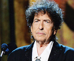 LOS ANGELES, CA - FEBRUARY 06: Bob Dylan speaks onstage at the 25th anniversary MusiCares 2015 Person Of The Year Gala honoring Bob Dylan at the Los Angeles Convention Center on February 6, 2015 in Los Angeles, California. The annual benefit raises critical funds for MusiCares' Emergency Financial Assistance and Addiction Recovery programs. For more information visit musicares.org. (Photo by Kevin Mazur/WireImage)