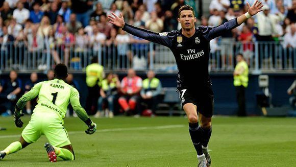Cristiano abrió el marcador ante el Málaga en el minuto 2' y encarriló el partido para ganar La Liga. Foto: AFP.