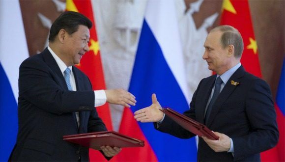 El presidente ruso Vladimir Putin y el líder chino Xi Jinping. Foto: EFE.