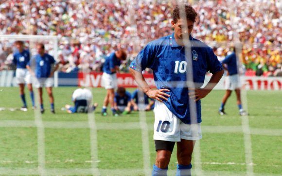 FILE - In this July 17, 1994 file photo, Roberto Baggio of Italy looks disappointed after Brazilian goalkeeper Taffarel saved his penalty shot, during the World Cup Final, in Pasadena, Ca., USA. (AP Photo/Luca Bruno, File)
