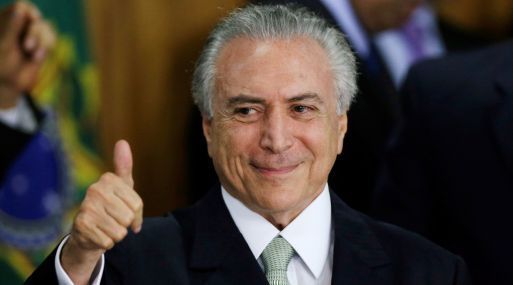 Brazil's interim President Michel Temer gestures during a ceremony where he made his first public remarks after the Brazilian Senate voted to impeach President Dilma Rousseff, at the Planalto Palace in Brasilia, Brazil, May 12, 2016. REUTERS/Ueslei Marcelino       TPX IMAGES OF THE DAY
