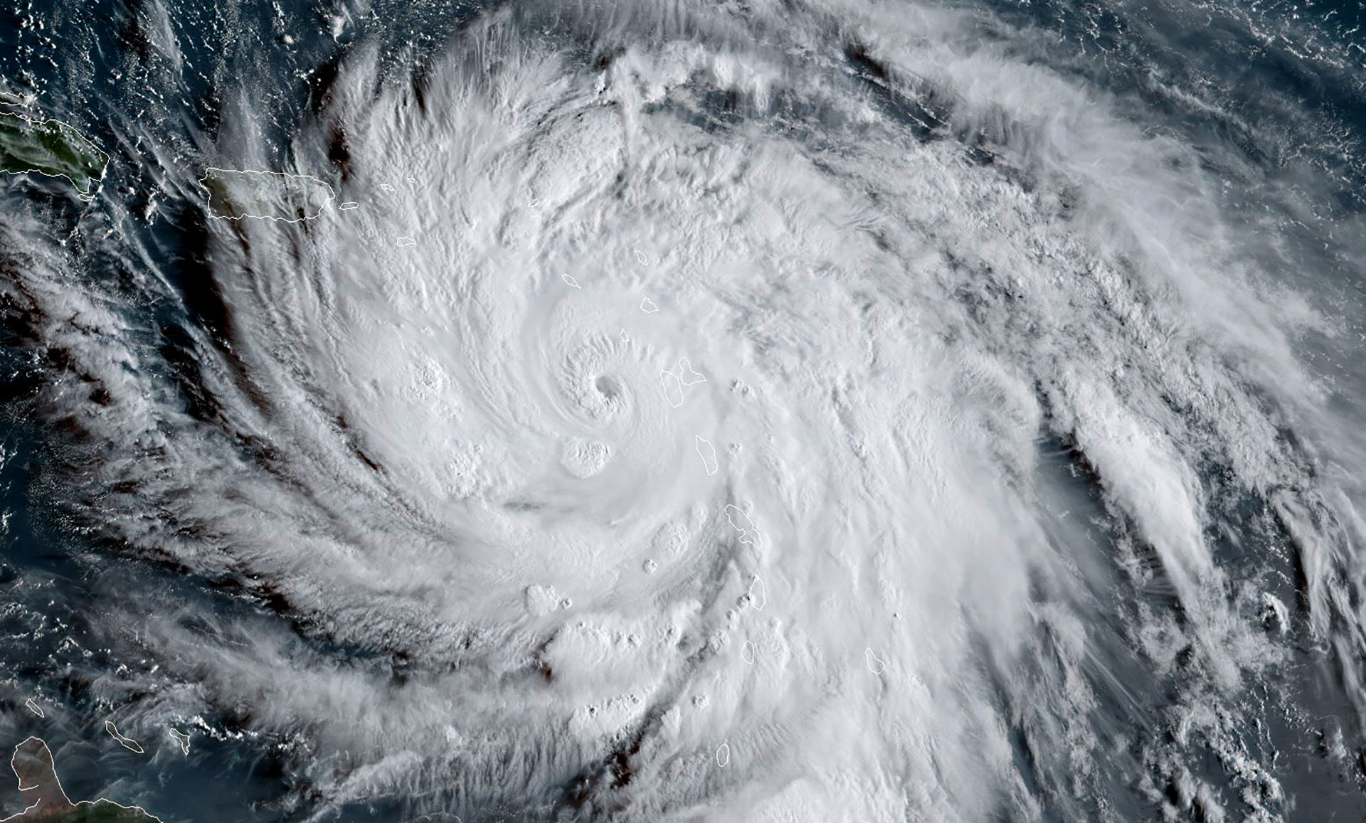 This satellite image obtained from the National Oceanic and Atmospheric Administration (NOAA) shows Hurricane Maria at 1130 UTC on September 19, 2017. Maria hit the eastern Caribbean island of Dominica on Tuesday, with its prime minister describing devastating damage as winds and rain from the powerful storm also hit territories still reeling from Irma. As residents hunkered down in their homes the Category Five hurricane made landfall with top winds swirling at 160mph (257kph), the US National Hurricane Center said. / AFP PHOTO / NOAA/RAMMB / Jose ROMERO / RESTRICTED TO EDITORIAL USE - MANDATORY CREDIT "AFP PHOTO / NOAA/RAMMB" - NO MARKETING NO ADVERTISING CAMPAIGNS - DISTRIBUTED AS A SERVICE TO CLIENTS